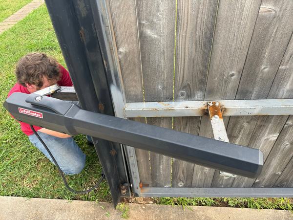 Just wow. A linear operator hanging off a rusty, makeshift bracket and sticking way out at an angle it was never meant to run at. It's not supposed to look anything like this.