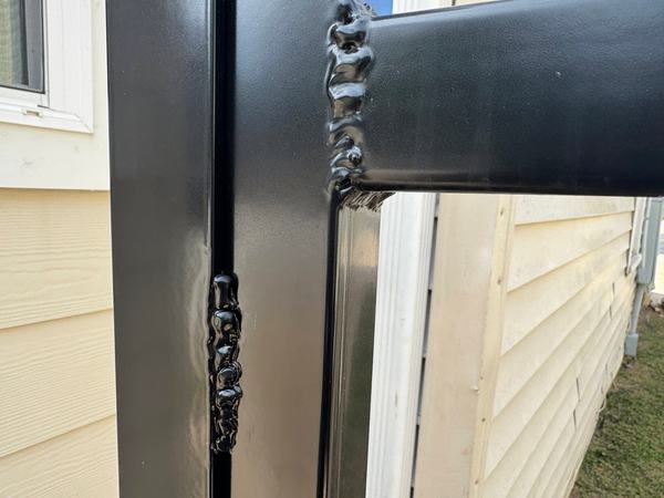 Lumpy, sloppy welds, then powder coated like that would hide them. It didn't. It just made the bad welds shiny.